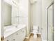 Bathroom with double vanity, tile floors, and glass enclosed shower at 2414 Clock Face Ct, Lawrenceville, GA 30043