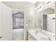 En suite bathroom featuring double vanity sinks, tile floors, and good natural light at 2414 Clock Face Ct, Lawrenceville, GA 30043