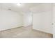 Spacious bedroom with neutral carpet, white walls, and ceiling light at 2414 Clock Face Ct, Lawrenceville, GA 30043