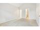 Spacious bedroom with a neutral color palette and carpeted floor at 2414 Clock Face Ct, Lawrenceville, GA 30043