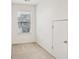 Minimalist bedroom with window, neutral carpet, and closet providing ample storage at 2414 Clock Face Ct, Lawrenceville, GA 30043