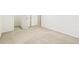 Bedroom featuring neutral carpet and a doorway, offering a blank canvas at 2414 Clock Face Ct, Lawrenceville, GA 30043
