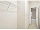 Walk-in closet features wire shelving and access to the neutral toned carpeted hallway at 2414 Clock Face Ct, Lawrenceville, GA 30043