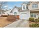 Charming home with brick accents, an attached garage, and well-maintained landscaping at 2414 Clock Face Ct, Lawrenceville, GA 30043