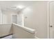 Neutral toned carpeted hallway on the second floor at 2414 Clock Face Ct, Lawrenceville, GA 30043