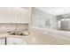 Modern kitchen with an open layout, stainless steel sink, and ample counter space at 2414 Clock Face Ct, Lawrenceville, GA 30043