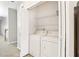 A white washer and dryer are located in the laundry closet at 2414 Clock Face Ct, Lawrenceville, GA 30043