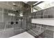 Contemporary shower featuring black marble tiling, modern fixtures, and a built-in shelf at 4234 Hamilton Mill Rd, Buford, GA 30519