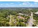 An aerial view showing the Buford property and surrounding lush greenery at 4238 Hamilton Mill Rd, Buford, GA 30519