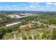 An aerial view of the home's setting, highlighting its proximity to nearby commercial development and lush green spaces at 4238 Hamilton Mill Rd, Buford, GA 30519