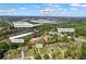 Aerial view in Buford, GA, showing the home's location with views of Buford High School and Lake Lanier in the distance at 4238 Hamilton Mill Rd, Buford, GA 30519