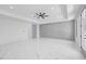 Bright bedroom with a geometric accent wall, modern ceiling fan, recessed lighting, and sleek marble floors at 4238 Hamilton Mill Rd, Buford, GA 30519