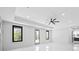 Spacious bedroom features a ceiling fan and recessed lights, with a view of the outside through a window at 4238 Hamilton Mill Rd, Buford, GA 30519