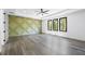 Bedroom with tray ceiling, recessed lights, hardwood floors, and accent wall at 4238 Hamilton Mill Rd, Buford, GA 30519