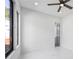 A bright, empty bedroom with hard floors and a ceiling fan at 4238 Hamilton Mill Rd, Buford, GA 30519
