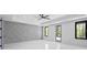 Large bedroom with an accent wall, ceiling fan, recessed lights, and ample natural light from multiple windows at 4238 Hamilton Mill Rd, Buford, GA 30519