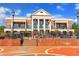 Buford Community Center and Theatre front view with a classic brick facade, flags, and landscaped entry at 4238 Hamilton Mill Rd, Buford, GA 30519