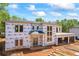 Modern home under construction featuring wrap and framing, ready for finishing touches at 4238 Hamilton Mill Rd, Buford, GA 30519