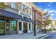 Dominick's restaurant featuring outdoor seating and brick facade, sidewalk, and vintage street lights at 4238 Hamilton Mill Rd, Buford, GA 30519