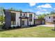 Beautiful modern home with a two-car garage, balcony, and lush green lawn at 4238 Hamilton Mill Rd, Buford, GA 30519