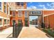 View of Tannery Row Ale House, with a brick exterior, overhead door and outdoor patio at 4238 Hamilton Mill Rd, Buford, GA 30519