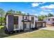 Contemporary home with sleek design, two-car garage, balcony, and green lawn at 4238 Hamilton Mill Rd, Buford, GA 30519