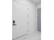 Clean hallway with a door and marble flooring at 4238 Hamilton Mill Rd, Buford, GA 30519