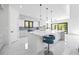A modern kitchen with white cabinets, marble floors, and stainless steel appliances at 4238 Hamilton Mill Rd, Buford, GA 30519