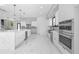 Modern kitchen with white cabinets, stainless steel appliances, and a large center island at 4238 Hamilton Mill Rd, Buford, GA 30519