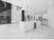 Open-concept kitchen with white cabinets, marble floors, and a large center island with seating at 4238 Hamilton Mill Rd, Buford, GA 30519
