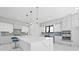 Bright, modern kitchen with white cabinets, quartz counters, and stainless steel appliances at 4238 Hamilton Mill Rd, Buford, GA 30519