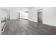 Modern living room with sleek flooring, glass railing and an open floor plan at 4238 Hamilton Mill Rd, Buford, GA 30519