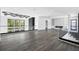 Expansive living space with modern fireplace and expansive views out of the floor to ceiling windows at 4238 Hamilton Mill Rd, Buford, GA 30519
