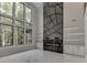 Bright and airy living room with a statement fireplace, white cabinetry, and expansive windows showcasing natural light at 4238 Hamilton Mill Rd, Buford, GA 30519