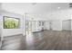 Open-concept living room with modern flooring, large windows, and contemporary design features at 4238 Hamilton Mill Rd, Buford, GA 30519