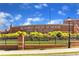 Exterior view of Buford High School, a well-maintained brick building with manicured landscaping and a welcoming entrance at 4238 Hamilton Mill Rd, Buford, GA 30519