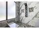 Contemporary shower with sleek fixtures, marble accents, and a built-in bench for a spa-like experience at 4238 Hamilton Mill Rd, Buford, GA 30519