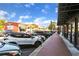 Street view highlighting a brick sidewalk lined with parked cars, storefronts, and charming architecture at 4238 Hamilton Mill Rd, Buford, GA 30519