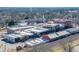 Aerial captures a quaint town layout, featuring brick buildings near railroad tracks at 4238 Hamilton Mill Rd, Buford, GA 30519