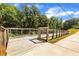 A wooden walkway nestled in a wooded area, offering scenic views and pedestrian access at 4238 Hamilton Mill Rd, Buford, GA 30519