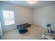 Bedroom featuring neutral carpet and a dark gray futon at 430 St Annes Pl, Covington, GA 30016