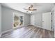 Bedroom featuring light-colored walls, wood-look floors, and a backyard view at 2151 Jonquil Ct, Canton, GA 30115