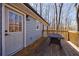 Wood deck and exterior features blue siding, a light fixture and a dark colored table at 2151 Jonquil Ct, Canton, GA 30115