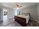 Main bedroom featuring wood-look floors, one window and a ceiling fan at 2151 Jonquil Ct, Canton, GA 30115