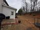 The backyard features a simple patio and door, waiting for you to personalize with your own landscaping ideas at 2535 Fairmont Park Ct, Dacula, GA 30019