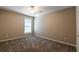 Simple yet cozy bedroom with neutral walls, carpet, and a window for natural light at 2535 Fairmont Park Ct, Dacula, GA 30019