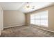 Spacious bedroom features a vaulted ceiling, fan, and a large window providing natural light at 2535 Fairmont Park Ct, Dacula, GA 30019