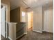 Upstairs hallway features neutral walls and carpet, leading to several bedrooms and a storage area at 2535 Fairmont Park Ct, Dacula, GA 30019