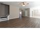 Spacious living room with hardwood floors, staircase, and abundant natural light at 2535 Fairmont Park Ct, Dacula, GA 30019