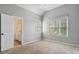 Calming bedroom with neutral tones, vaulted ceiling, large windows, and an en-suite bathroom for added convenience at 625 Jefferson Pl, Cumming, GA 30040
